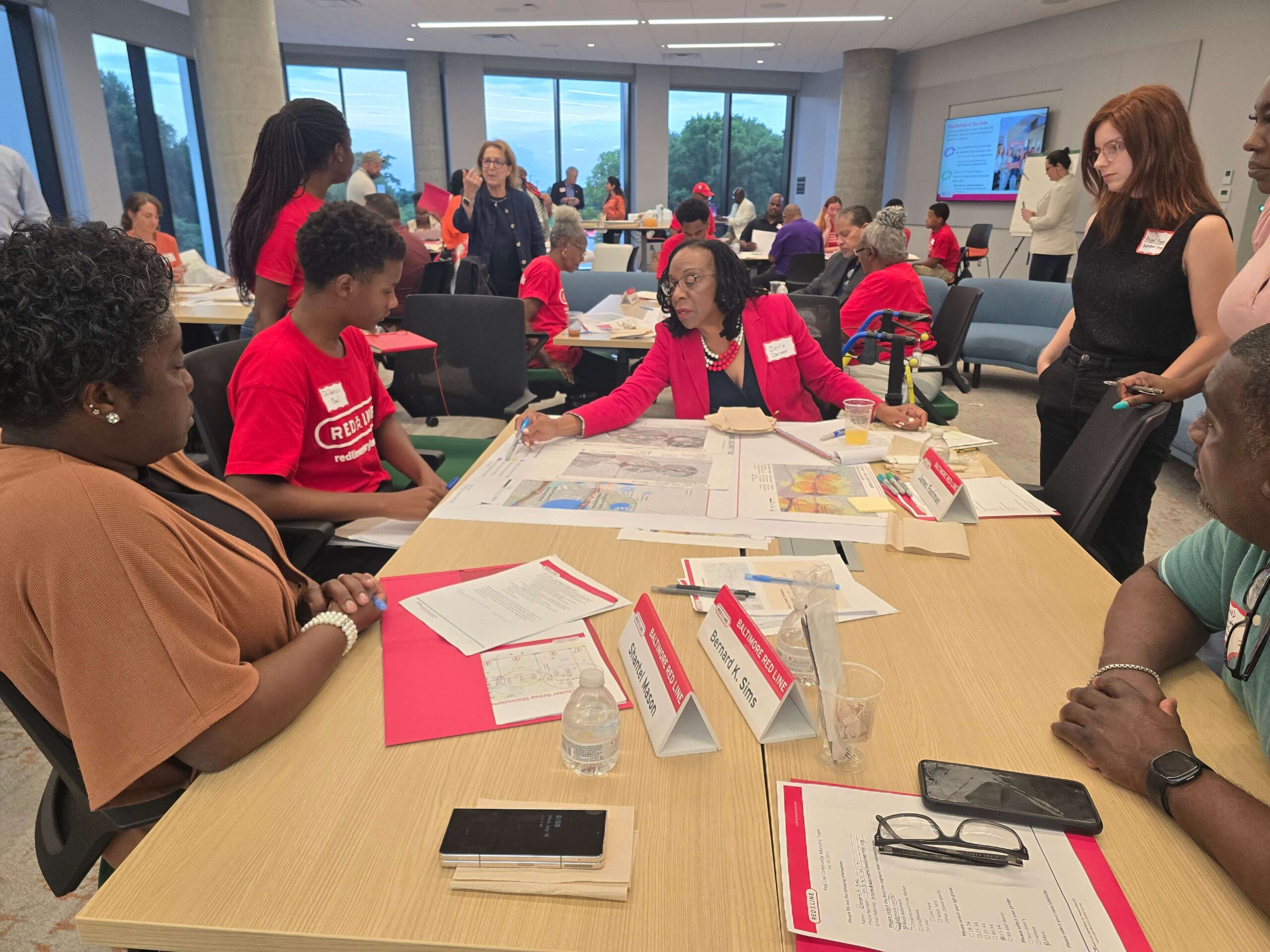 July 16, 2025 CAT Meeting people working around tables with maps